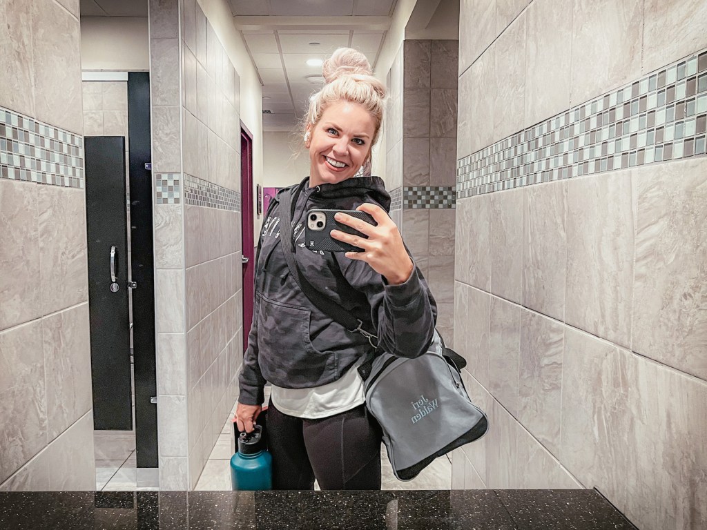 Jeri Walden in the bathroom at Planet Fitness taking a selfie.